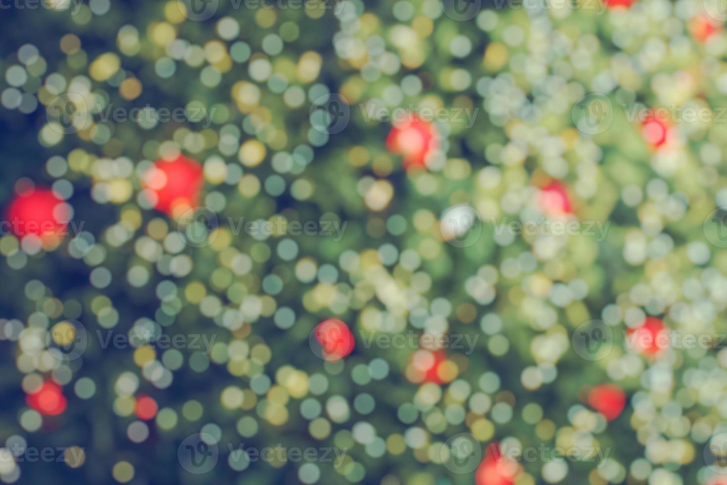 Abstract blurred christmas tree with bokeh light background photo