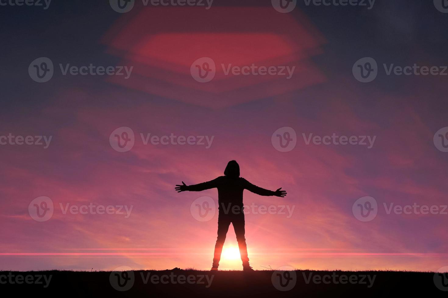 man trekking in the mountain with a sunset background in summertime photo