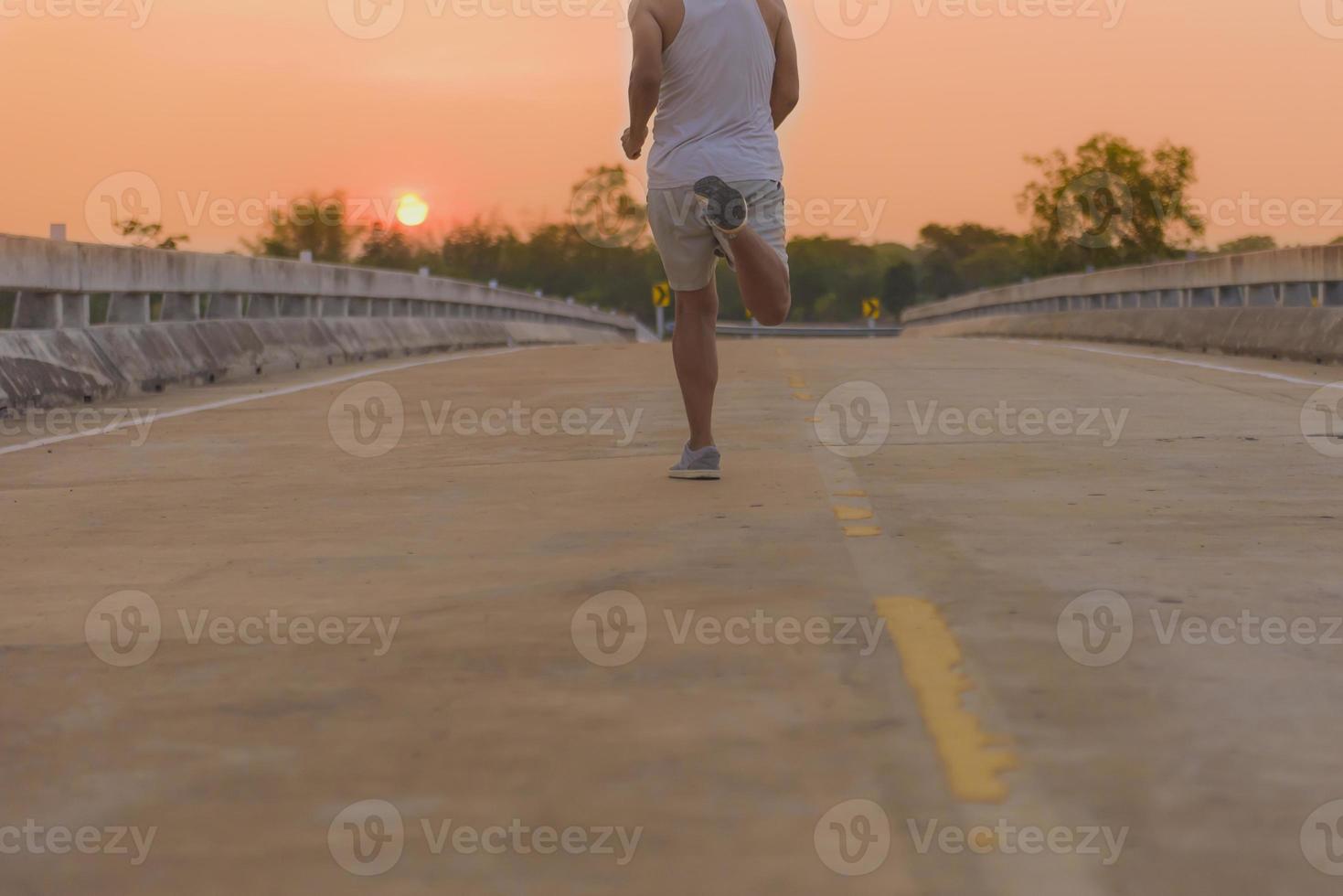man with runner on the street be running for exercise. photo