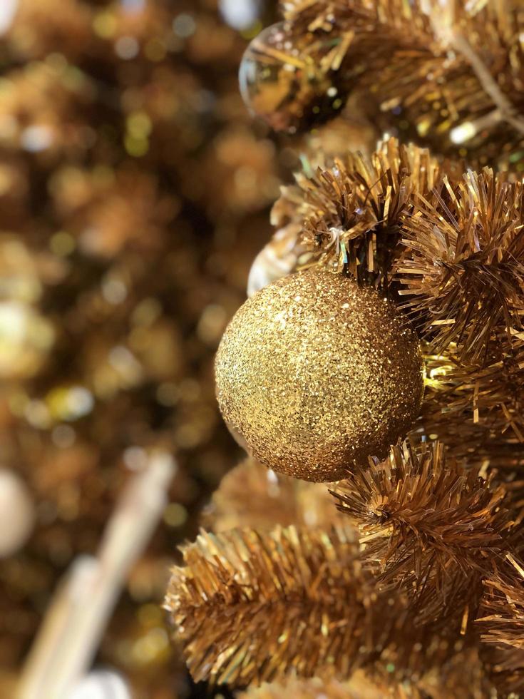 Golden Merry Christmas ball background. Happy new year and merry christmas 2023 photo