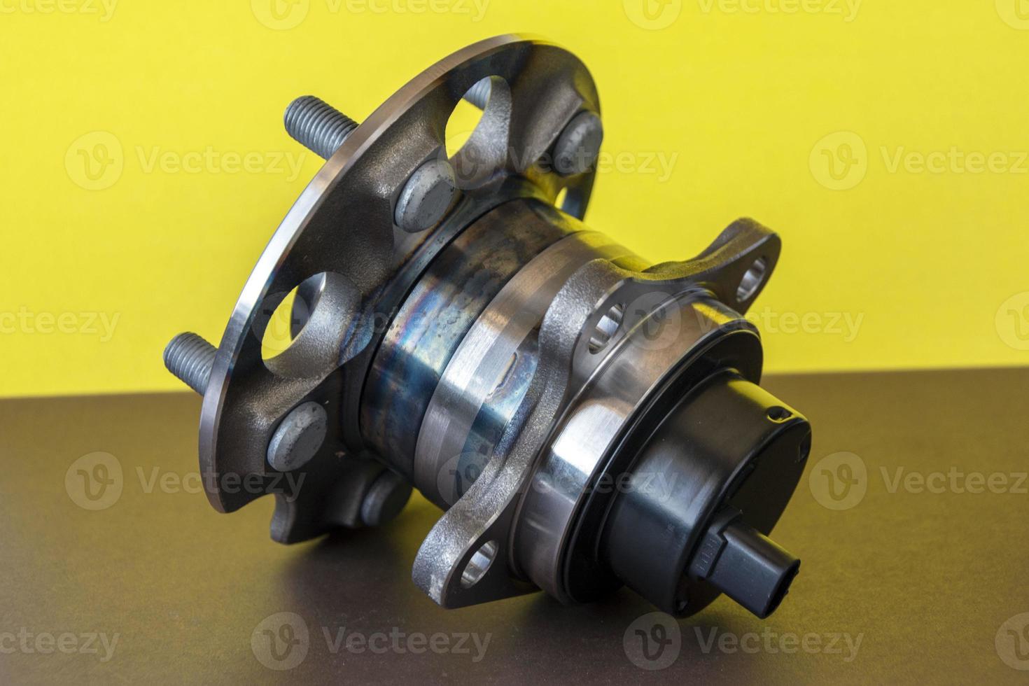 Rear wheel hub assembly with ABS sensor on a colored background, auto parts, bearing photo