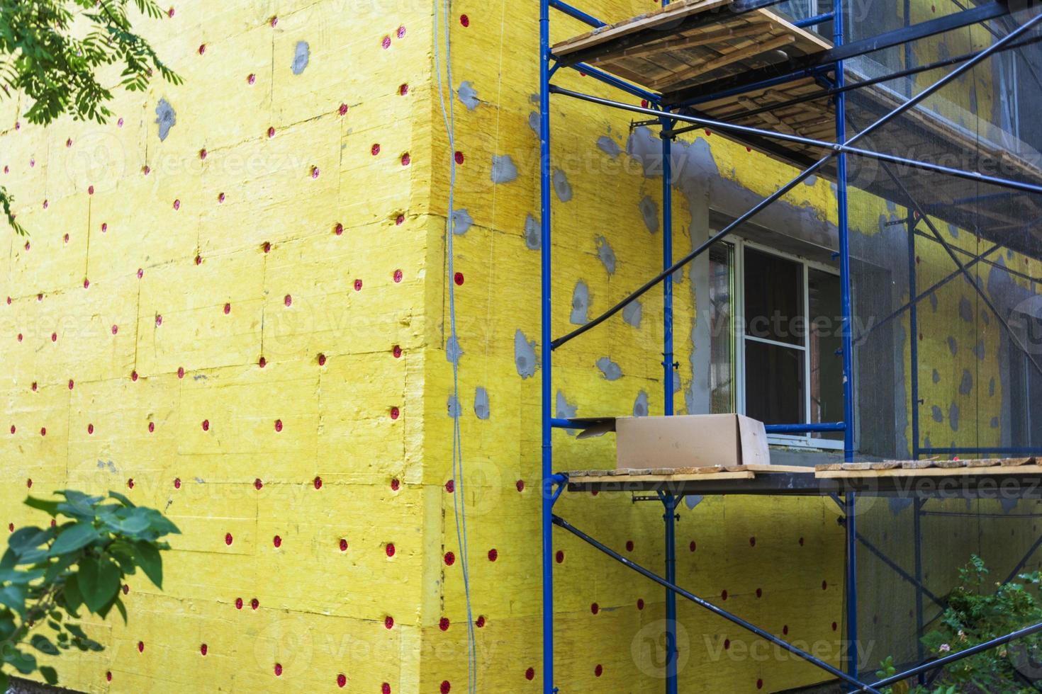 Insulation of the walls of a multi-storey building, Thermal insulation of the exterior walls of the house. photo