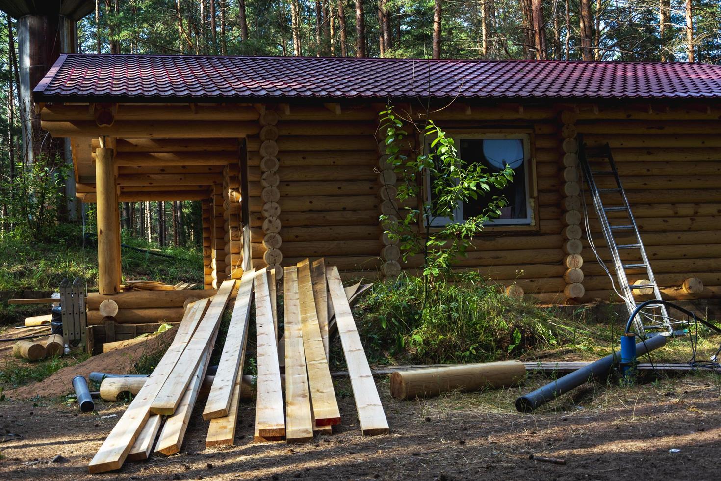 Wooden boards on the construction site of a wooden country house, construction of a wooden log house, ecological housing photo