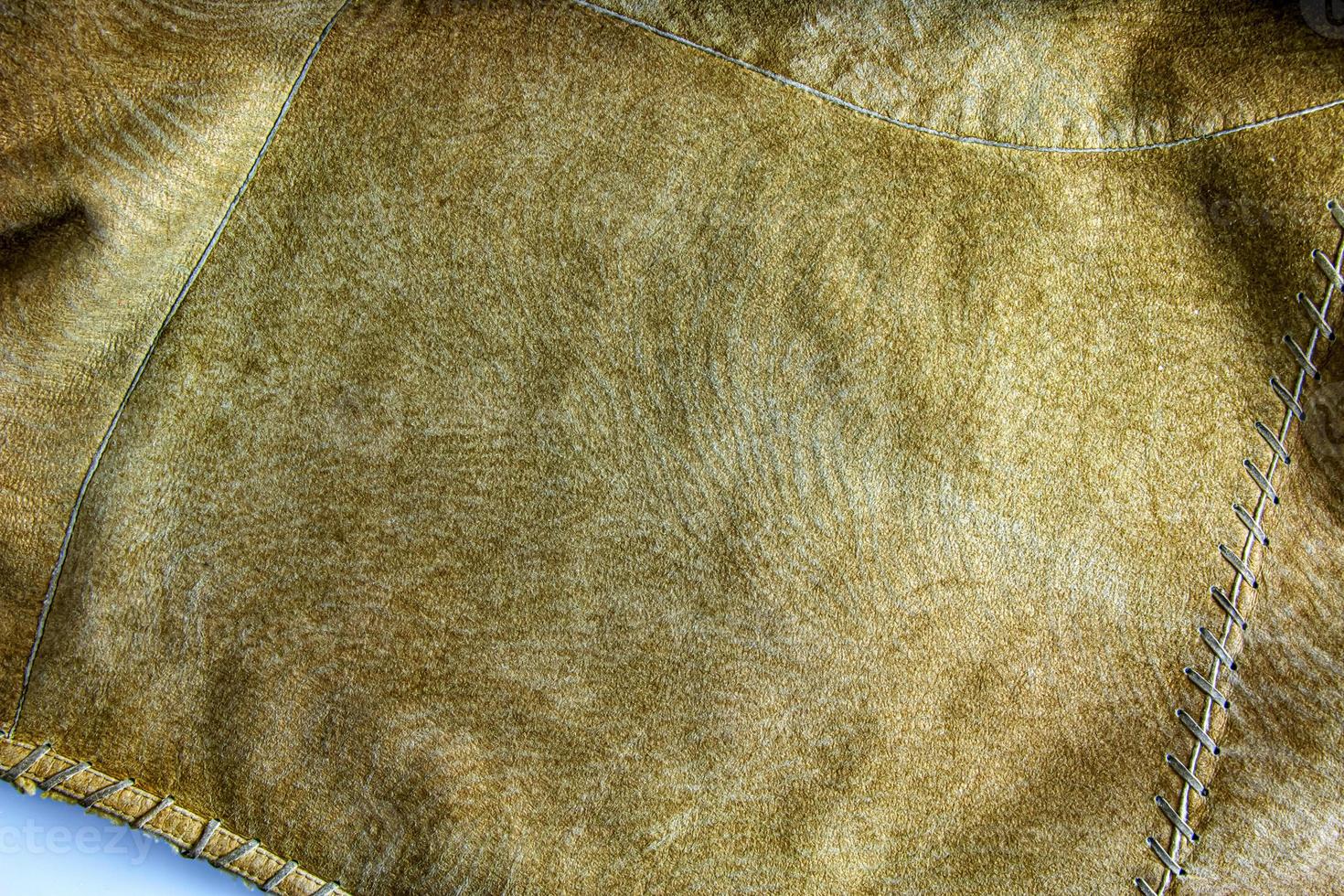 Leather background. Beige texture of leather, brown suede. photo