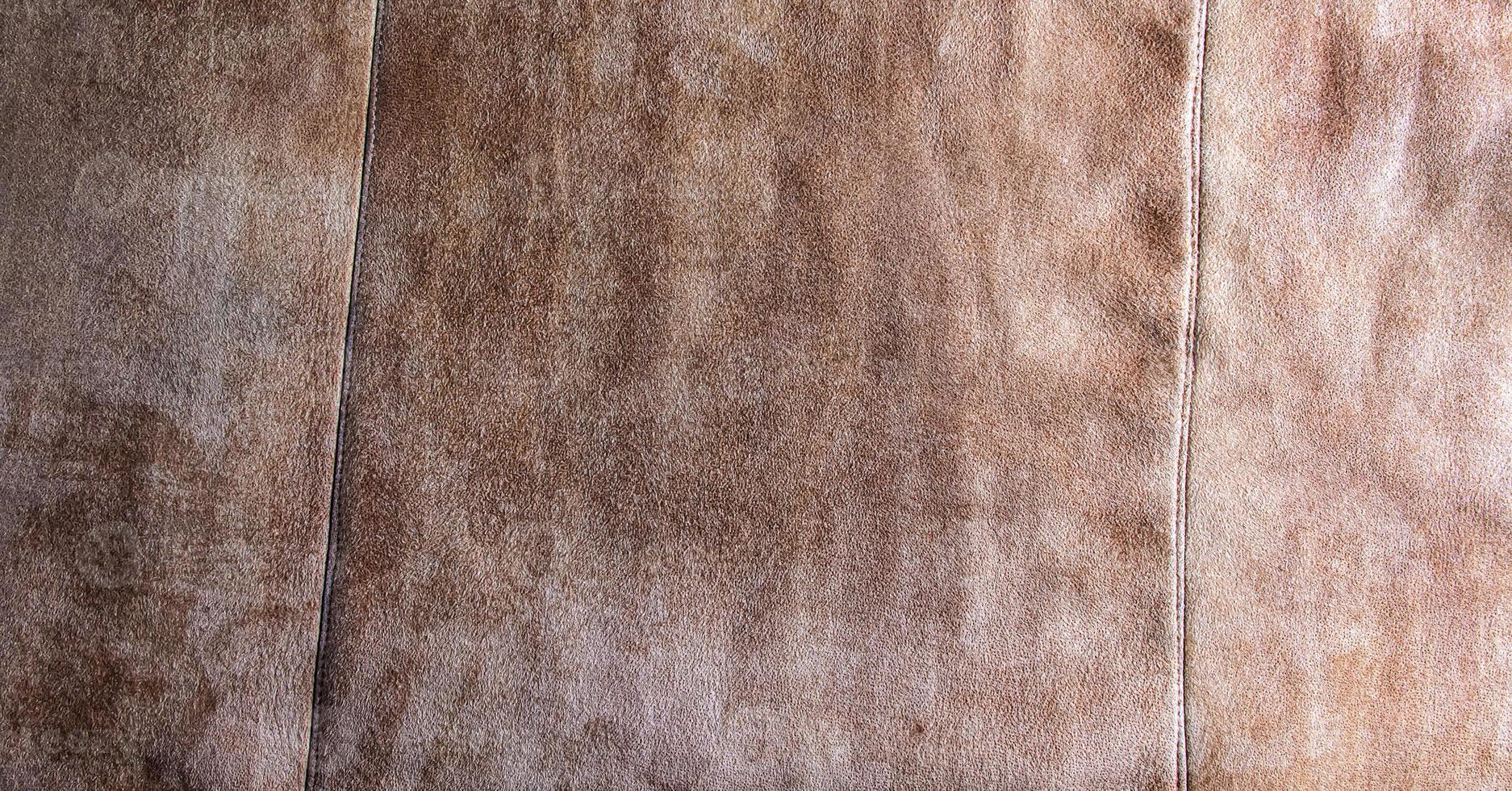 Leather background. Beige texture of leather, brown suede. photo