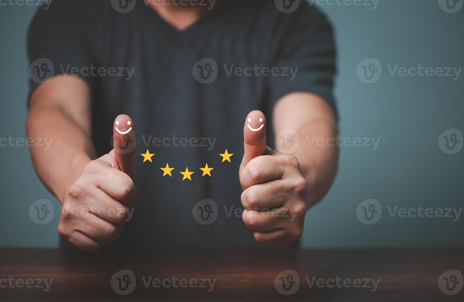 Businessman raised thumps up and give satisfaction five stars rating, sign of the top service, customer good service. photo