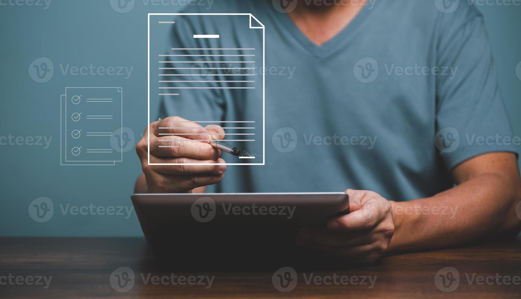 Man signing business contact on digital documents, digital business with electronic signature contact on tablet, e-signing, management, paperless office. photo