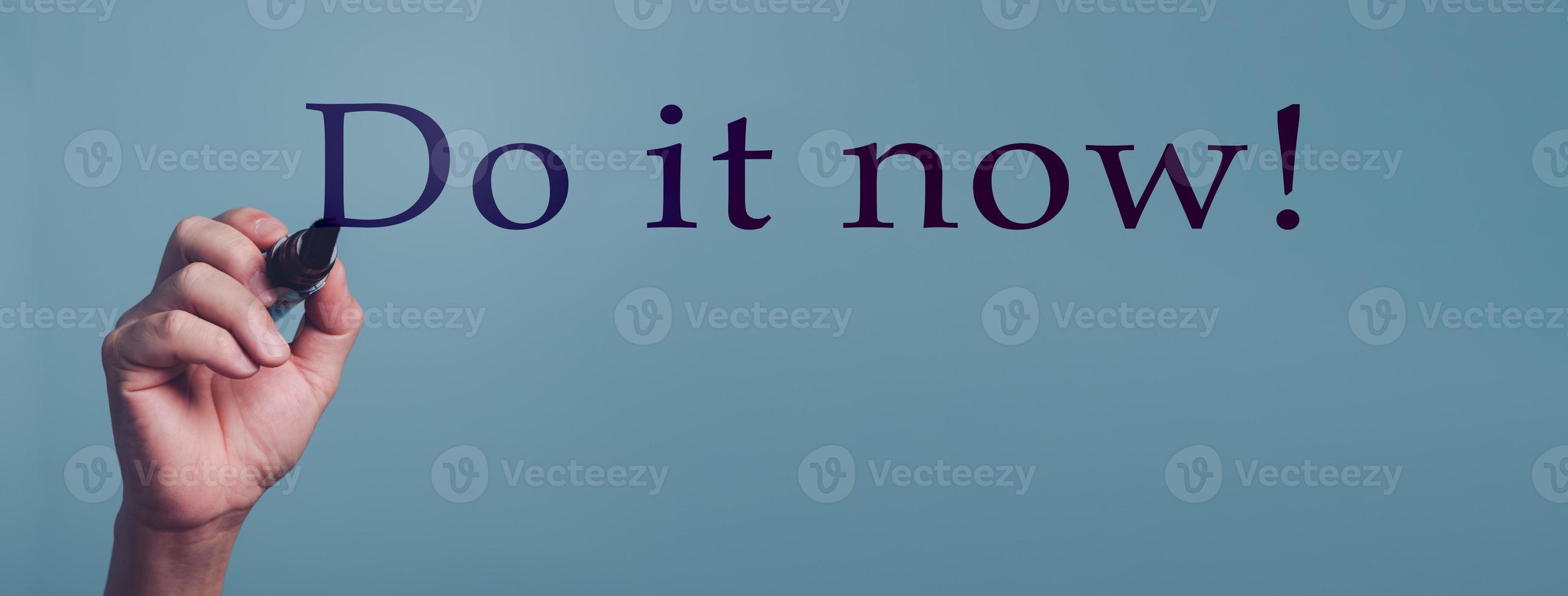 Do it now, Hand writing word for Inspirational phrase, a quote for working mood. photo