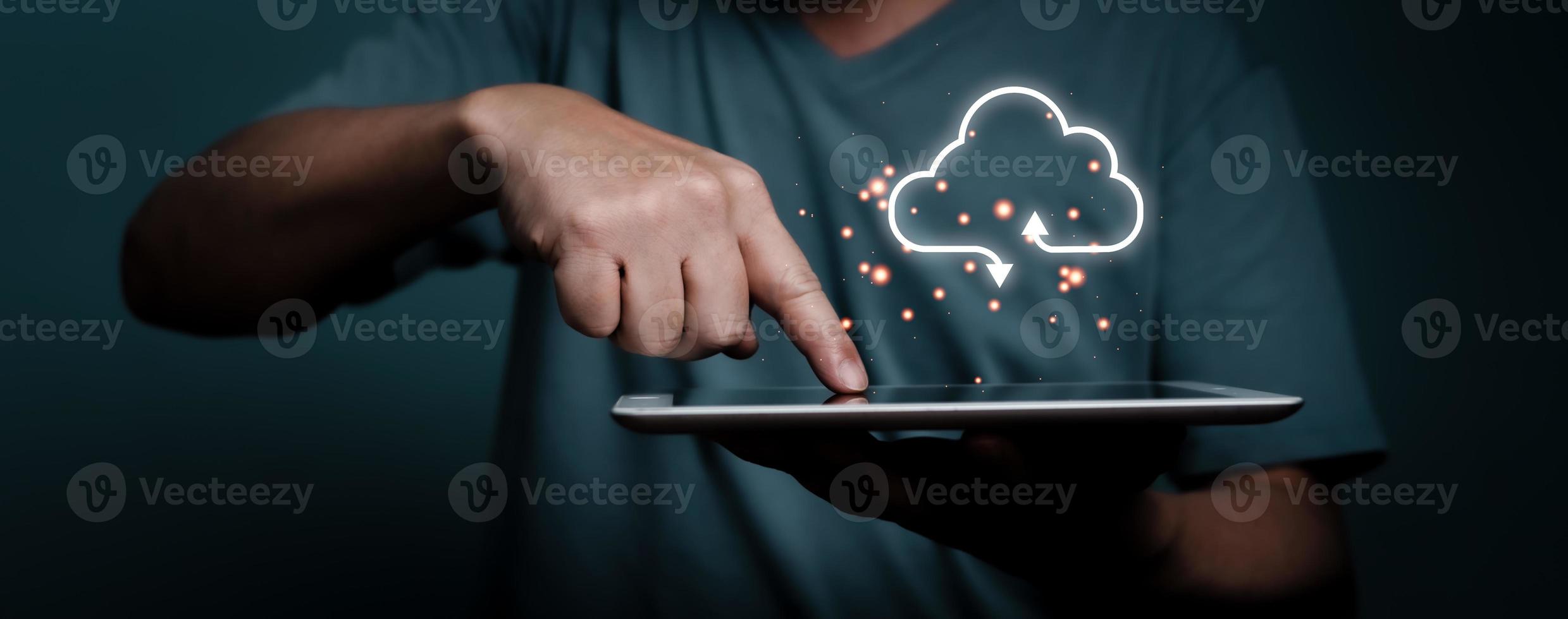Hand touching tablet with white cloud computing network technology concept. photo