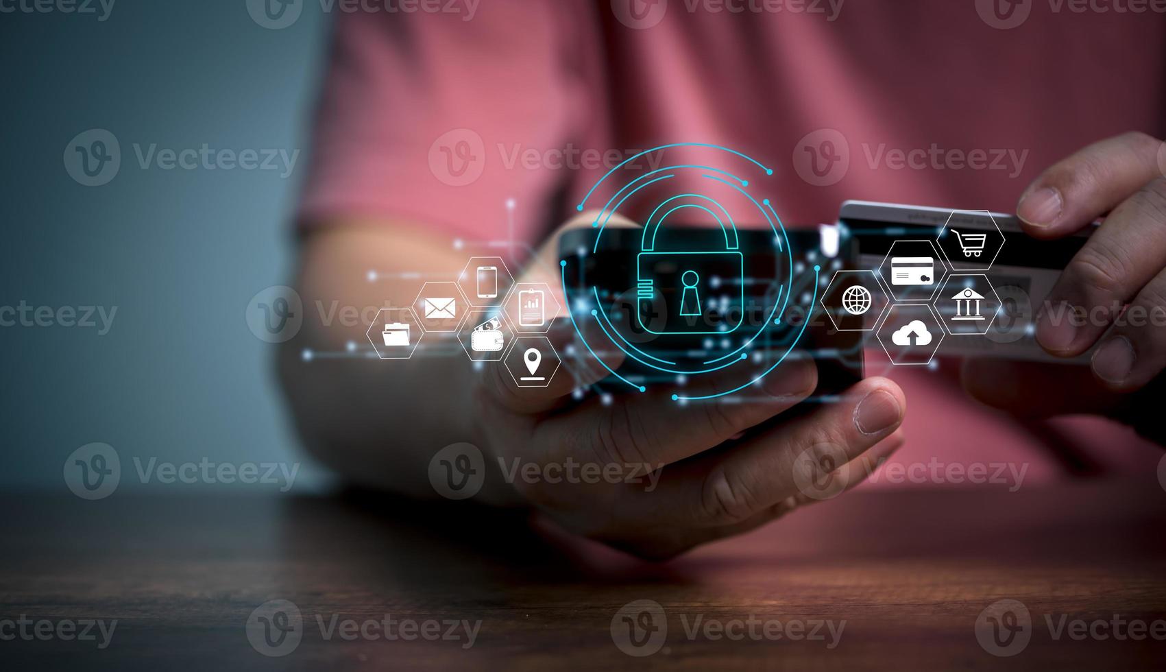 Cybersecurity and privacy concepts to protect data. Lock icon and internet network security technology. Businessman protecting personal data on smart phone with virtual screen interfaces. photo