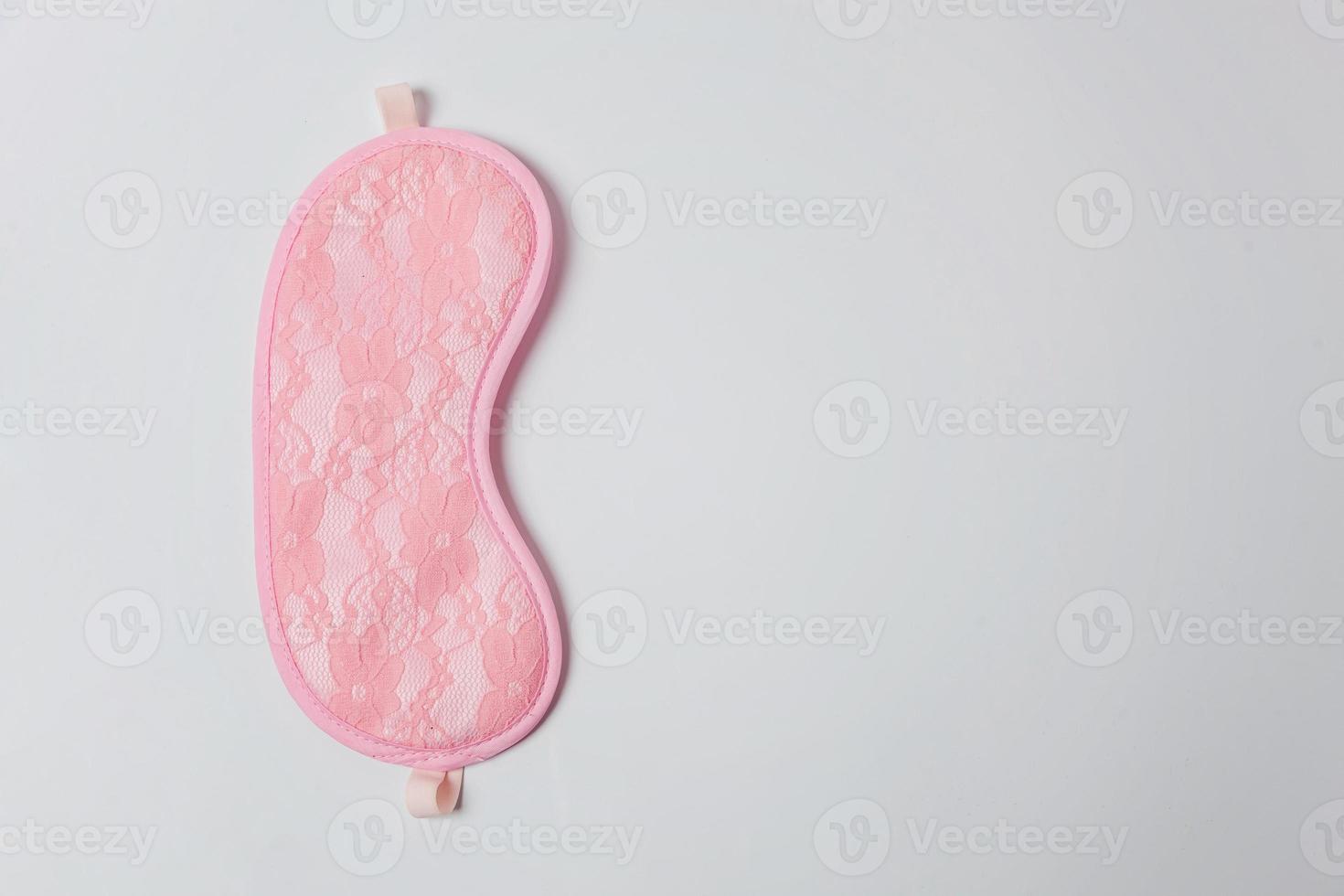 Sleeping eye mask, isolated on white background. Do not disturb me, let me sleep. Rest, good night, insomnia, relaxation, tired, travel concept. photo