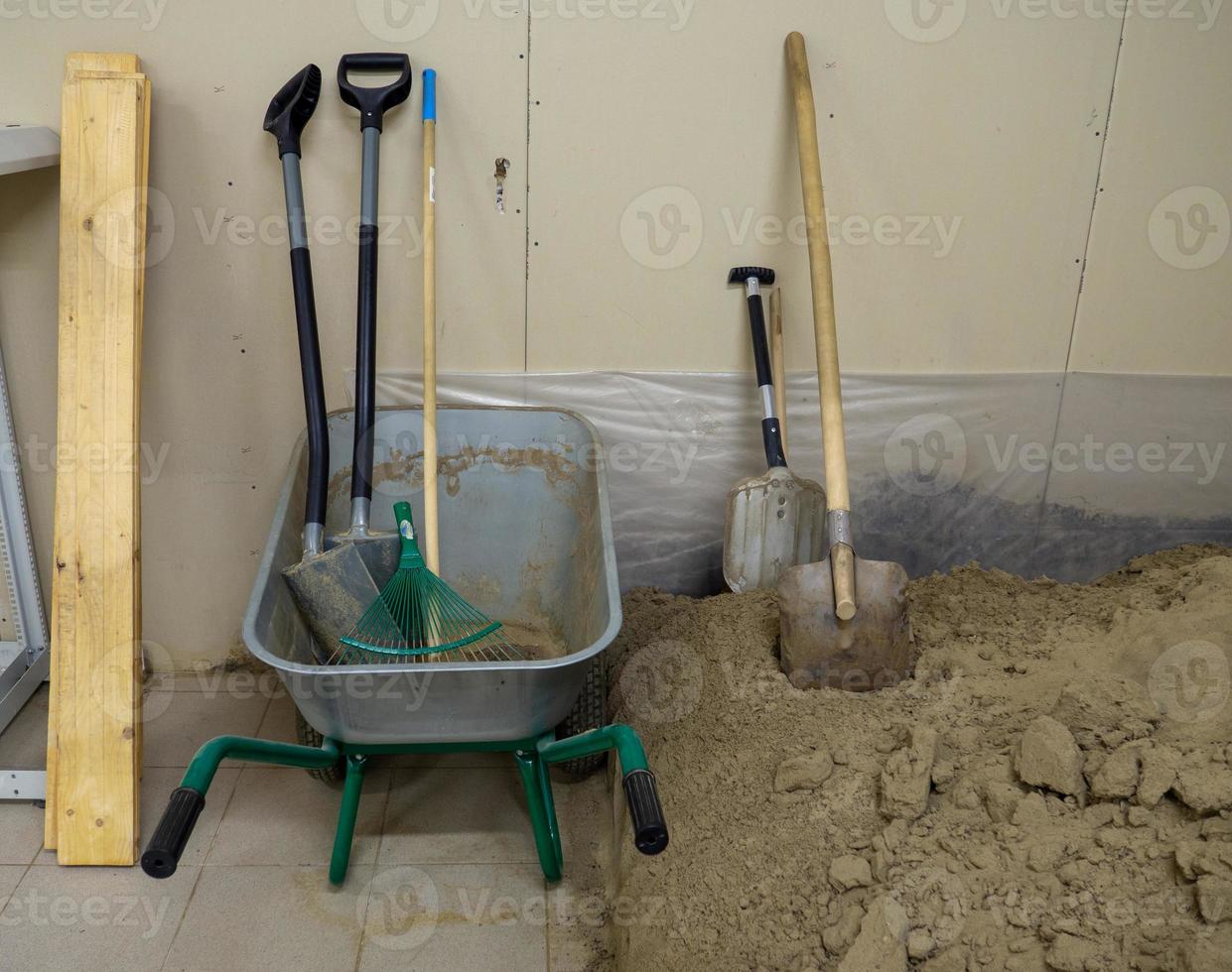 Digging tools.   Pile of construction sand photo