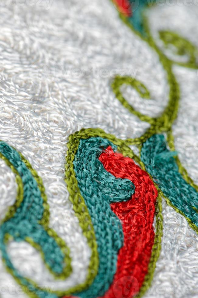 A closeup shot of national ornaments and patterns of Central Asia on a piece of fabric photo