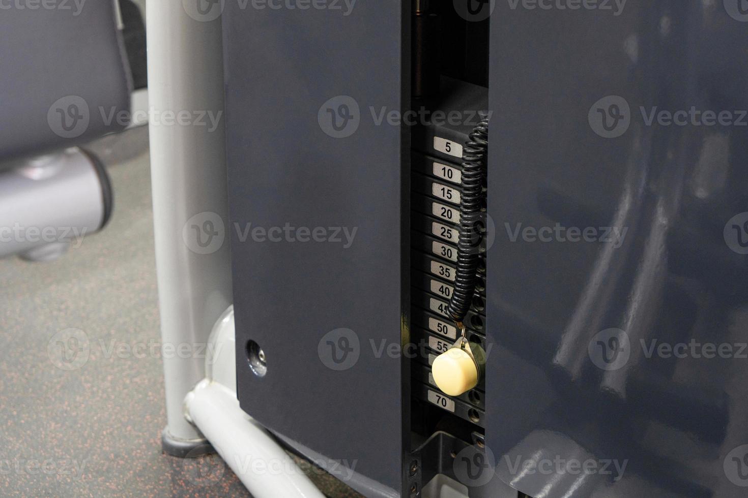 A closeup of the weight machine plate numbers photo