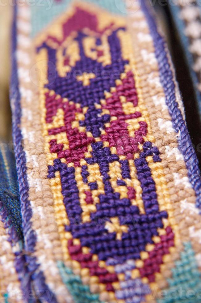 The decorative elements and ornaments on the national clothes of Uzbekistan photo