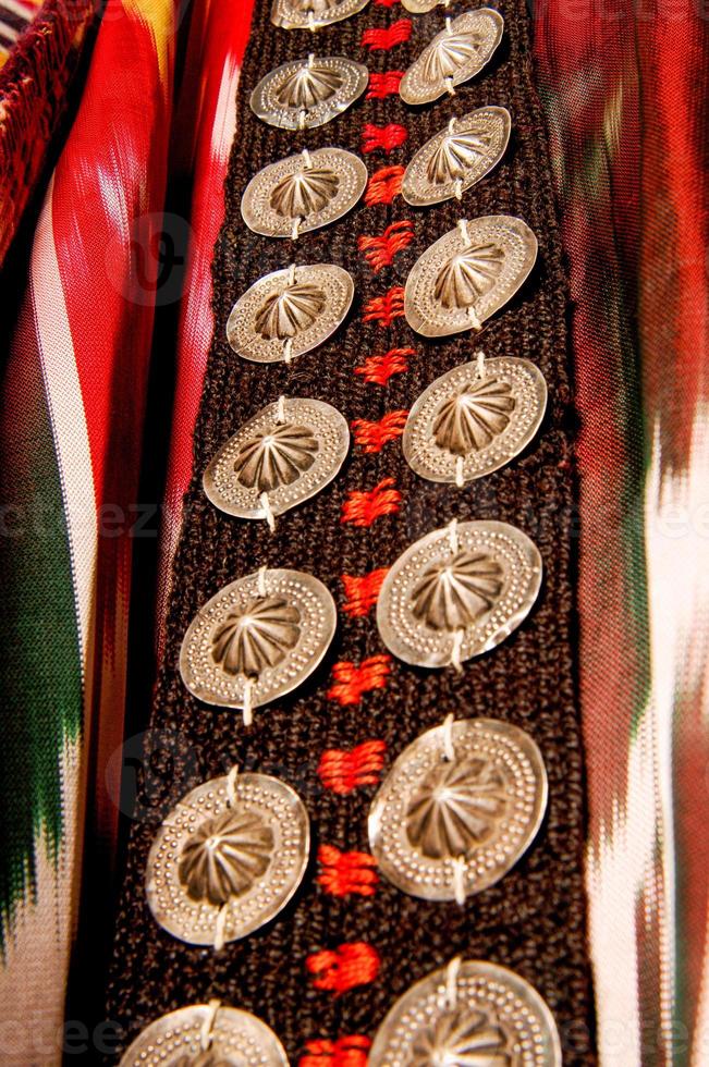 The decorative elements and ornaments on the national clothes of Uzbekistan photo