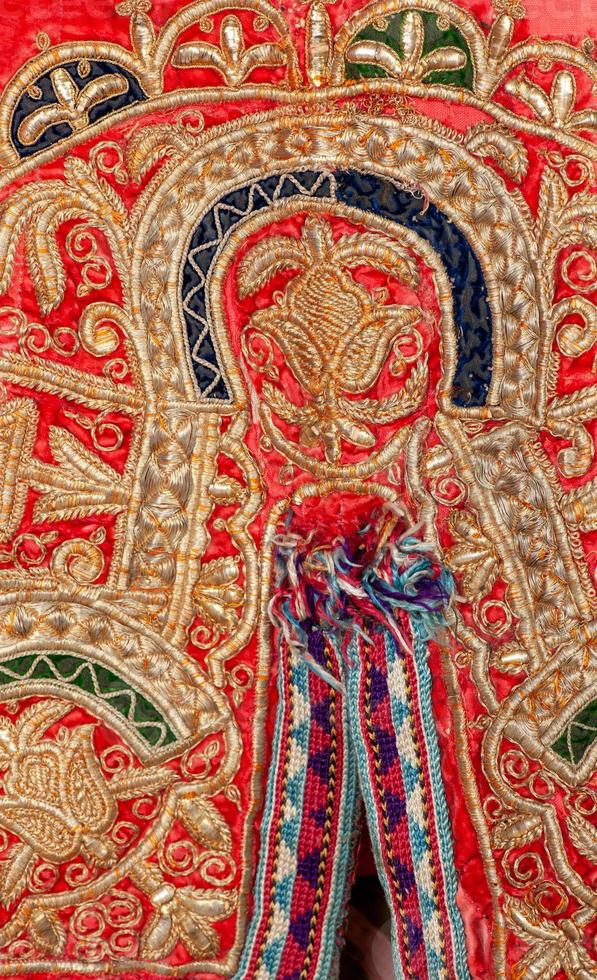 The decorative elements and ornaments on the national clothes of Uzbekistan photo