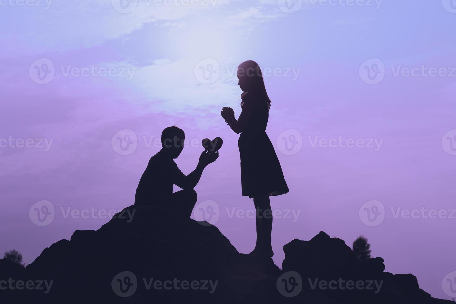 Happy young couple together against beautiful sunset. Freedom, photo