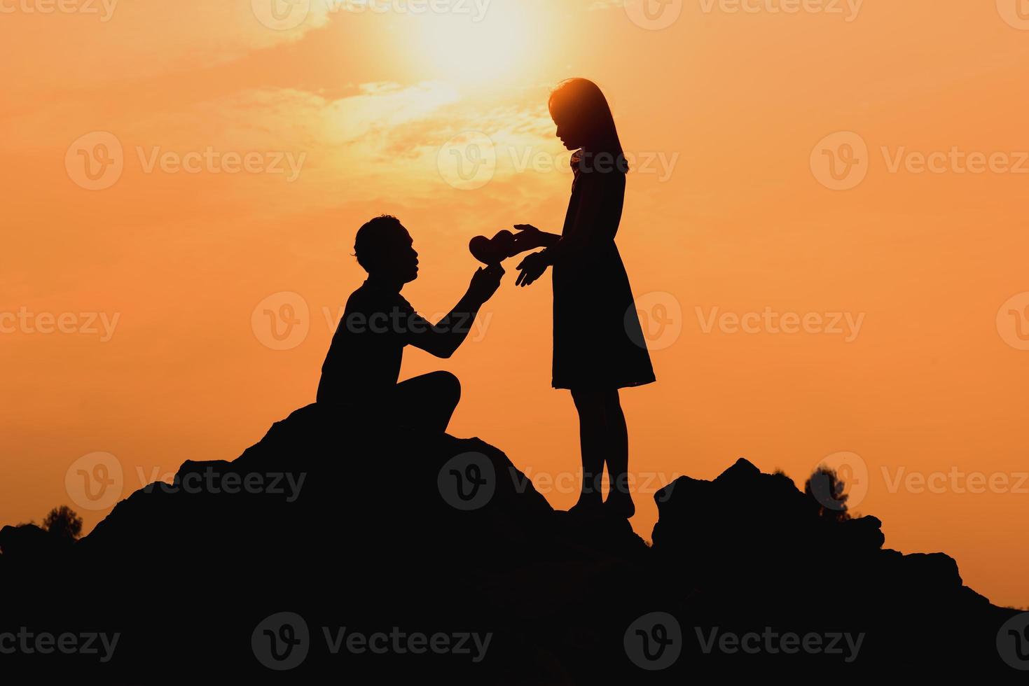 Happy young couple together against beautiful sunset. Freedom, photo