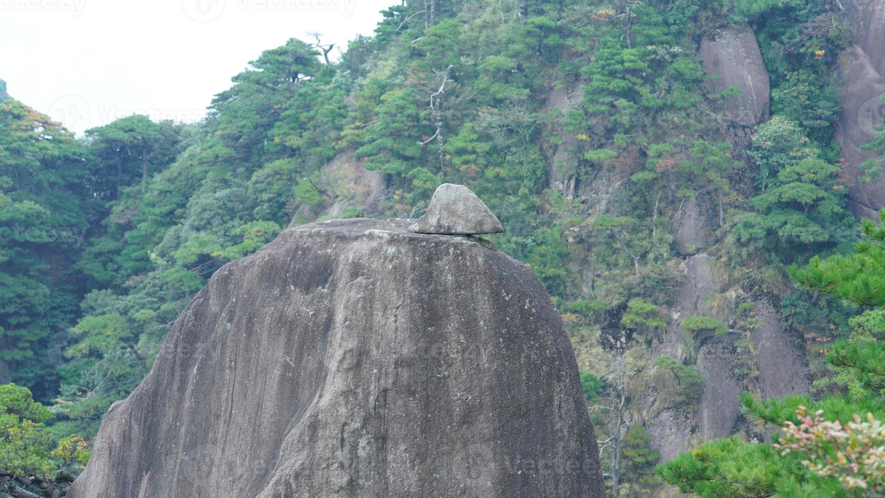The beautiful mountains landscapes with the green forest and the erupted rock cliff as background in the countryside of the China photo