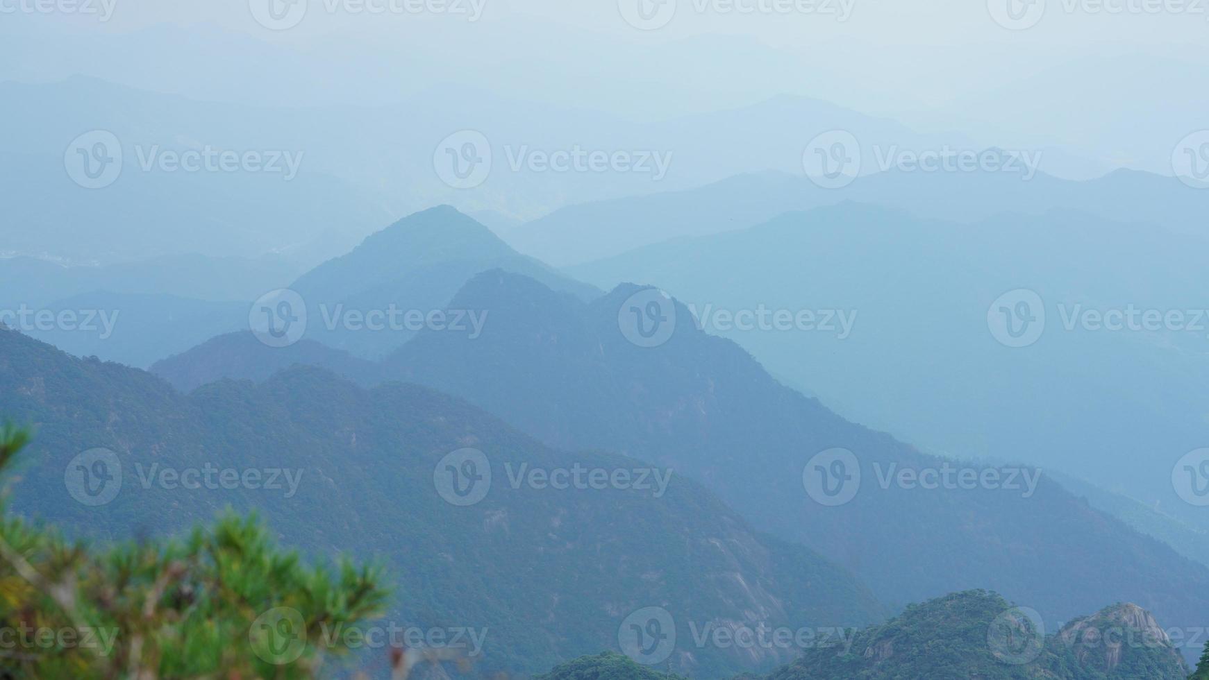The beautiful mountains landscapes with the green forest and the erupted rock cliff as background in the countryside of the China photo