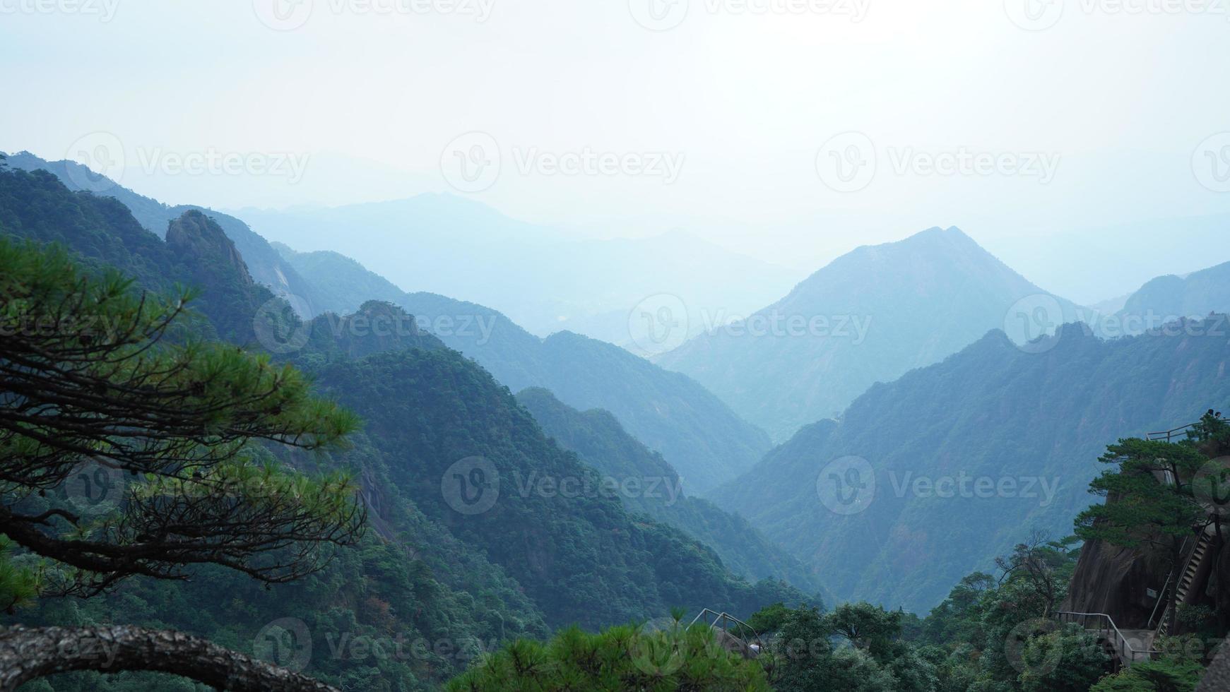 The beautiful mountains landscapes with the green forest and erupted rock cliff as background in the countryside of the China photo