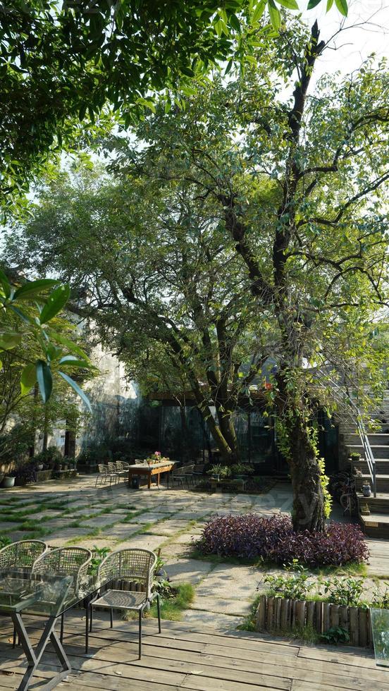 The beautiful traditional Chinese village view with the classical architecture and fresh green trees as background photo