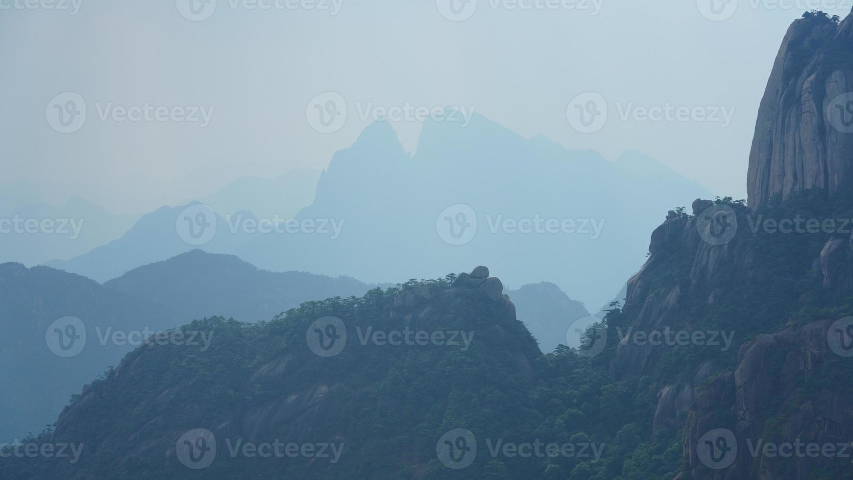 The beautiful mountains landscapes with the green forest and erupted rock cliff as background in the countryside of the China photo