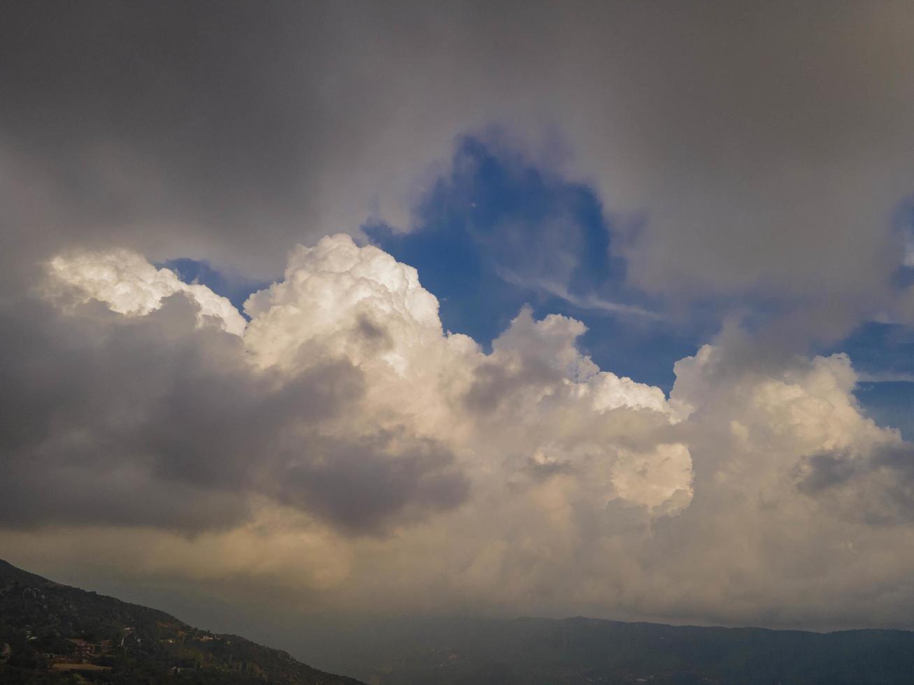 dance of the clouds. cloud and valley view. clouds over green valley photo