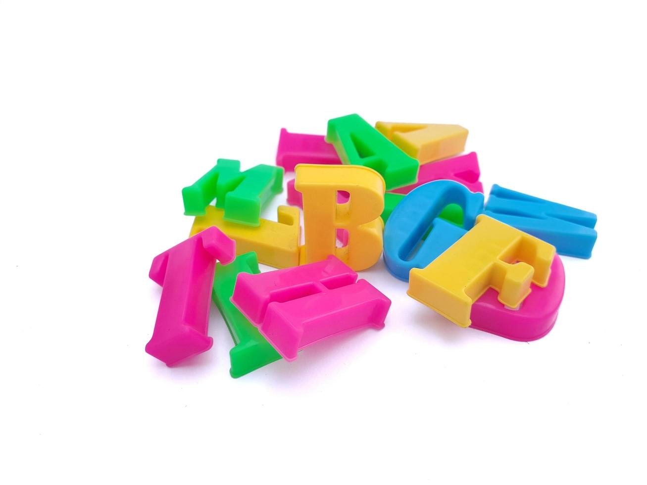 Close up of colorful alphabets on white background perfect for children's education photo