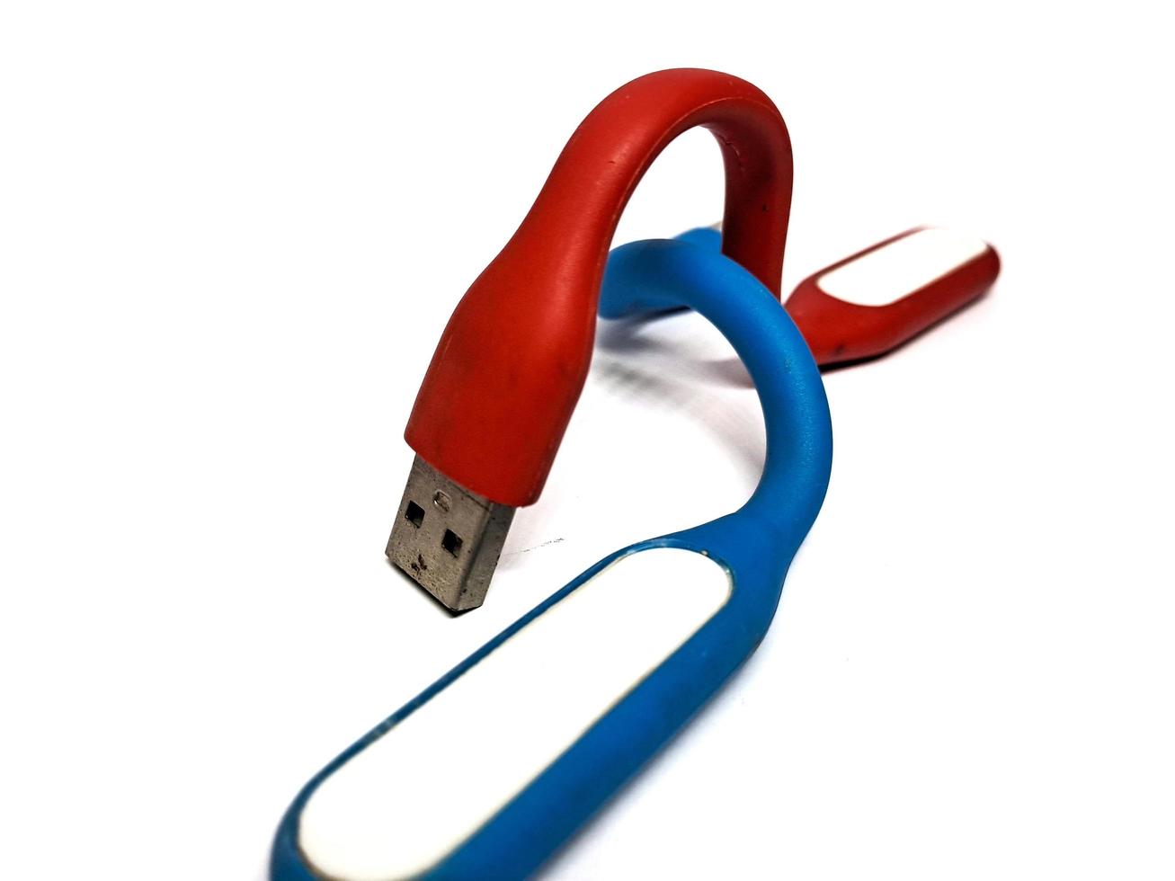 Red blue LED light, a stick that can be used as a power bank, white background photo