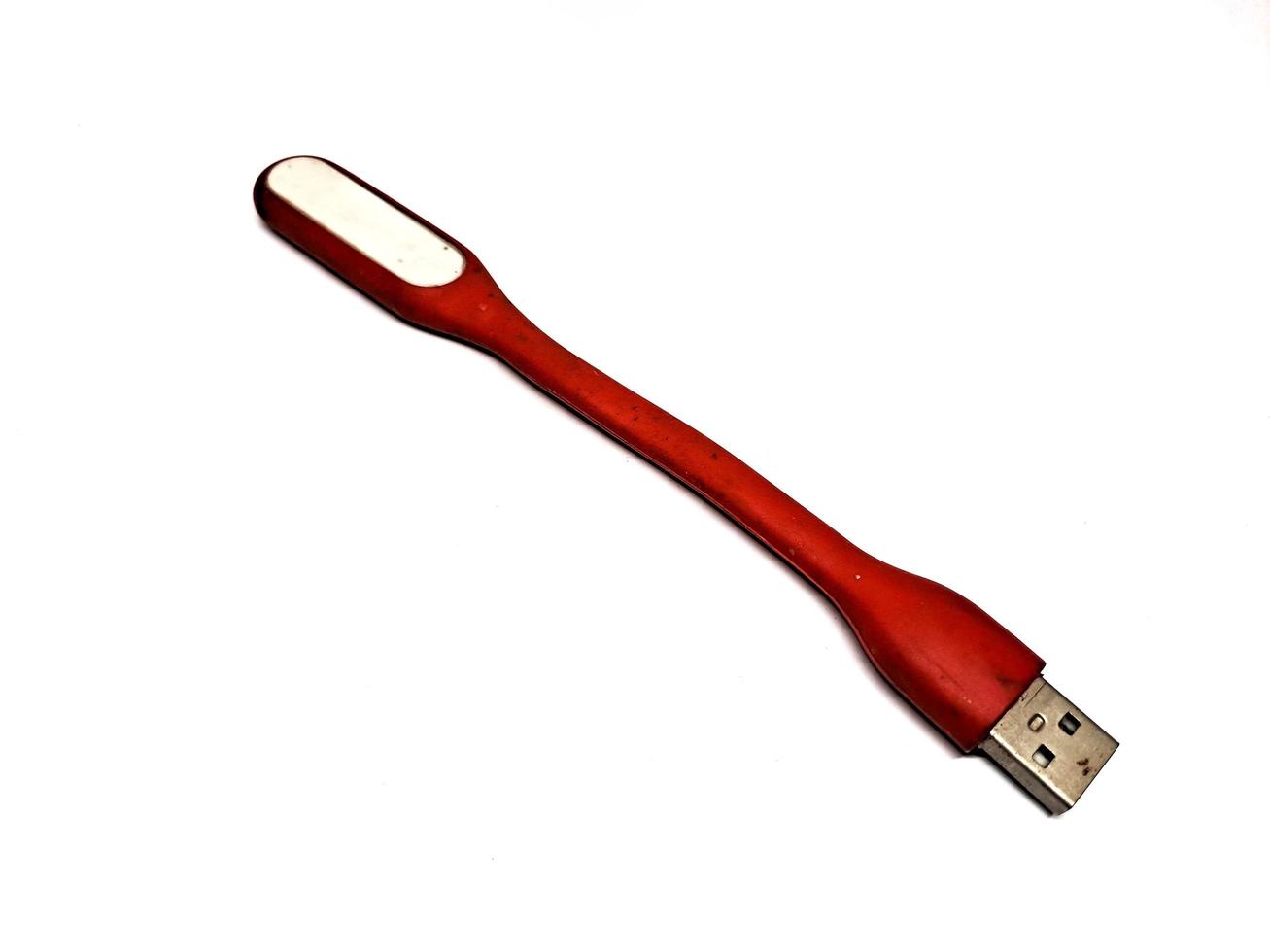 Red LED light stick that can be used as a power bank, white background photo