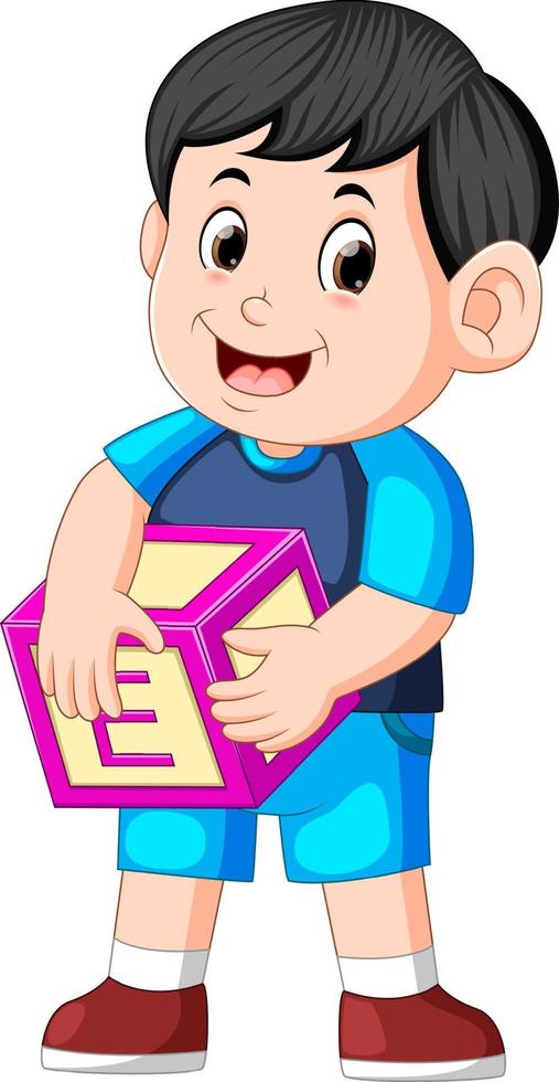 cute boy holding alphabet cube vector