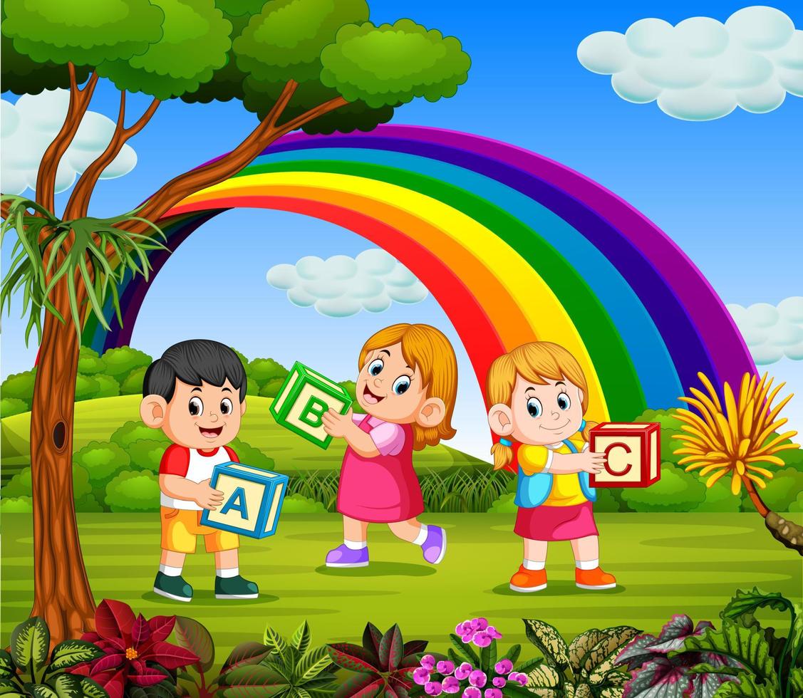 the children play and hold their Alphabet box vector