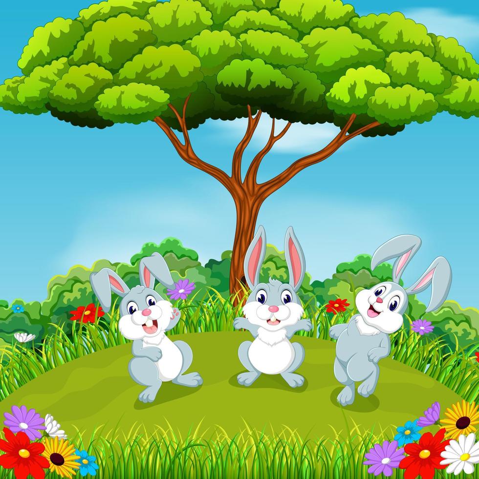 the beautiful view with three rabbits playing together under the huge tree vector