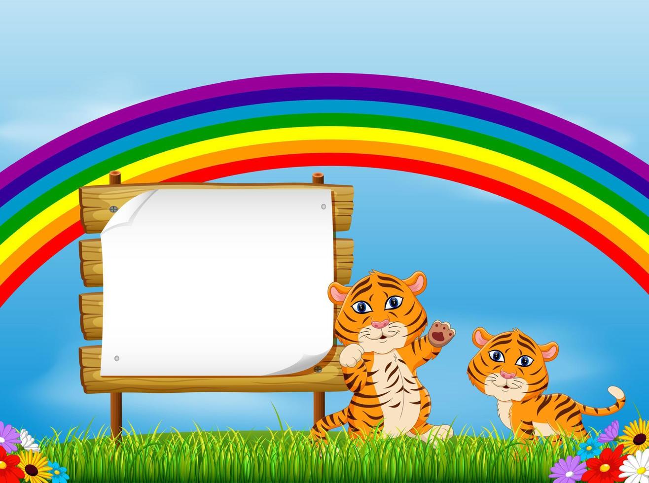 the nature view with the wooden board blank space and two baby tiger under the rainbow vector