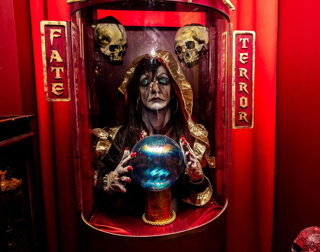 Old Fortune Telling Machine With Halloween Creature photo