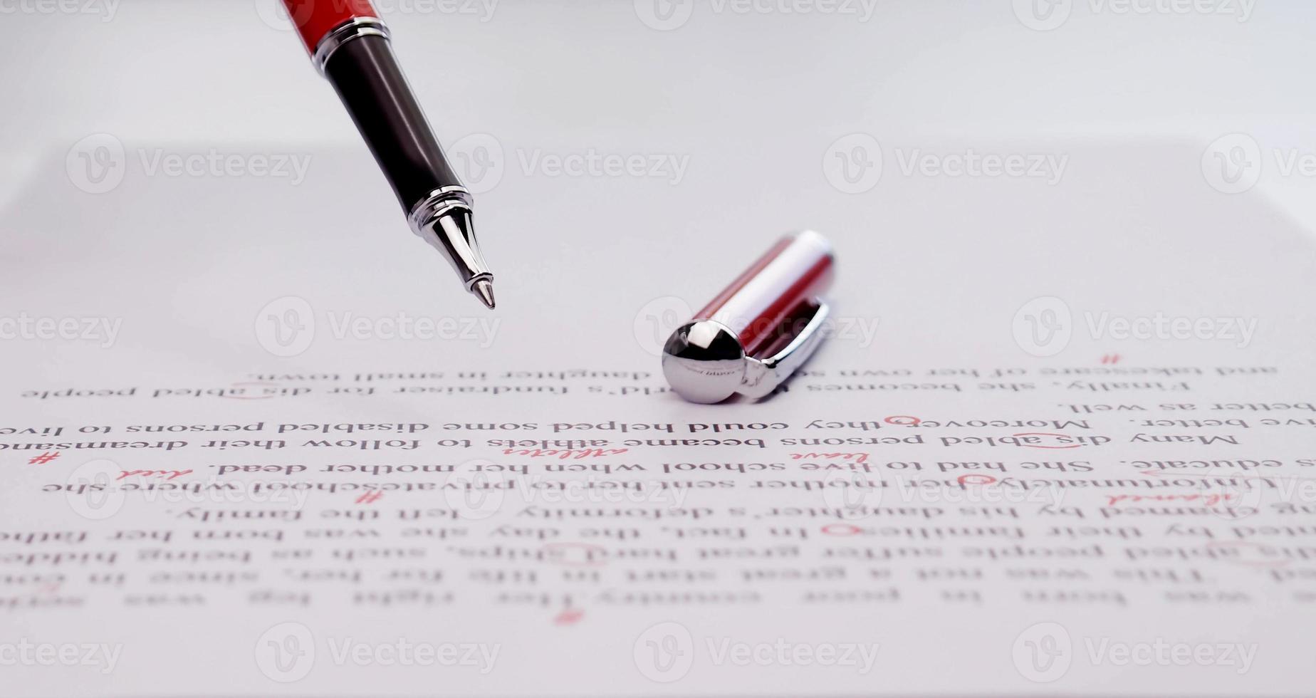 proofreading paper on table photo