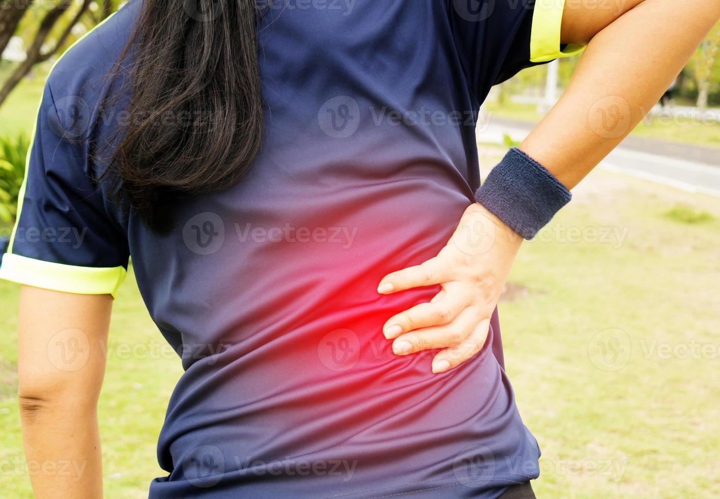 backache on womon's back photo