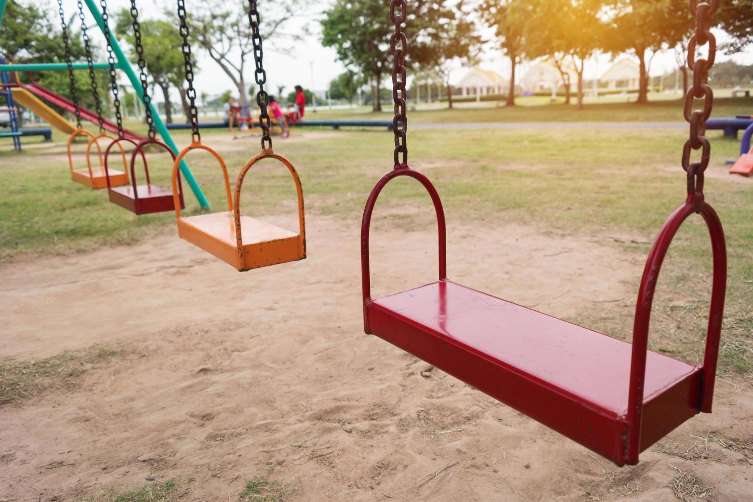 colorful swing set in playground photo