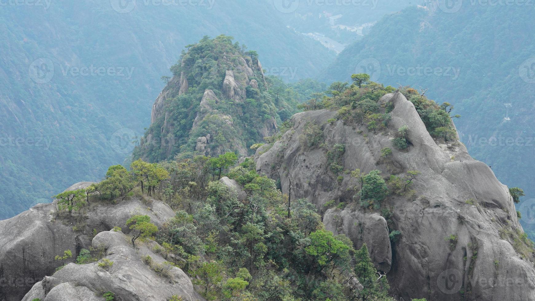 The beautiful mountains landscapes with the green forest and erupted rock cliff as background in the countryside of the China photo