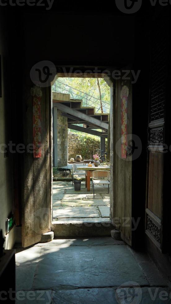 The beautiful garden view with the flowers and stone tables in the countryside village of the China photo