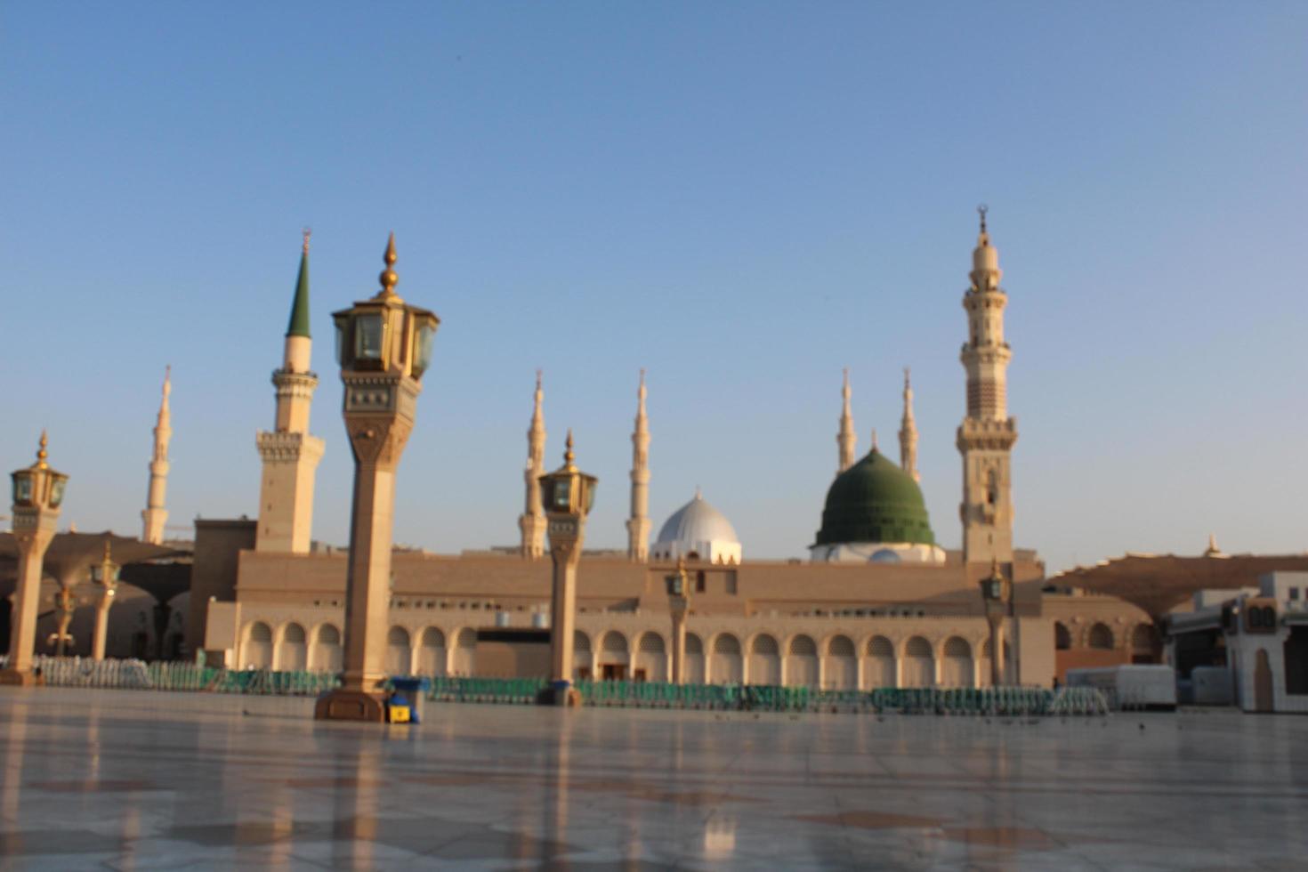 Medina, Saudi Arabia, Oct 2022 - Beautiful daytime view of Masjid Al Nabawi, Medina's green dome, minarets and mosque courtyard. photo