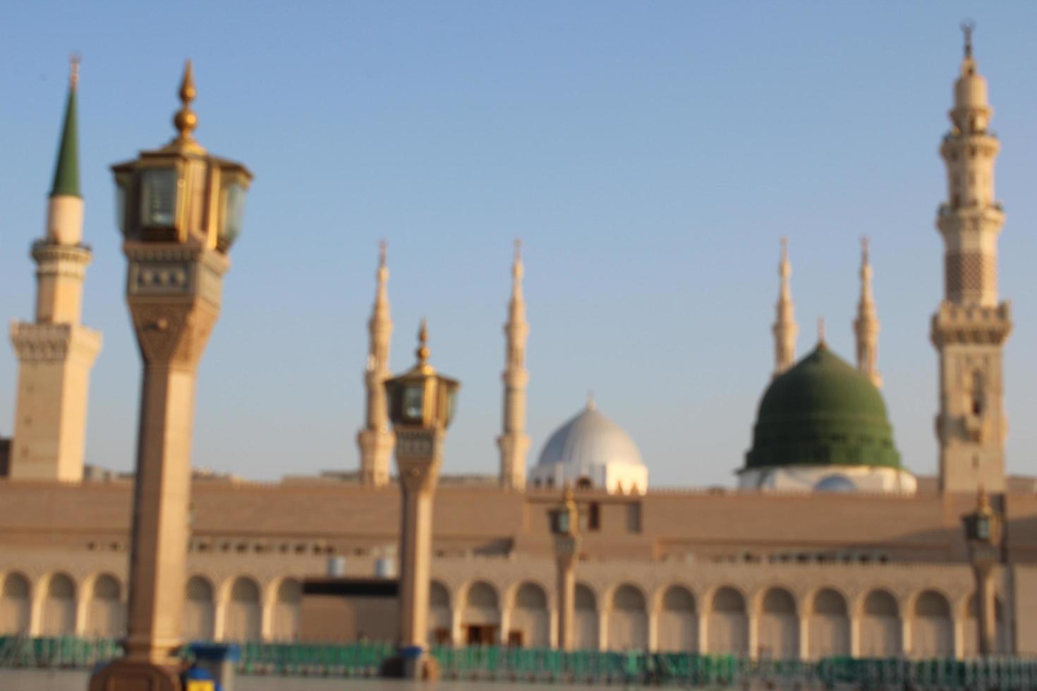 Medina, Saudi Arabia, Oct 2022 - Beautiful daytime view of Masjid Al Nabawi, Medina's green dome, minarets and mosque courtyard. photo