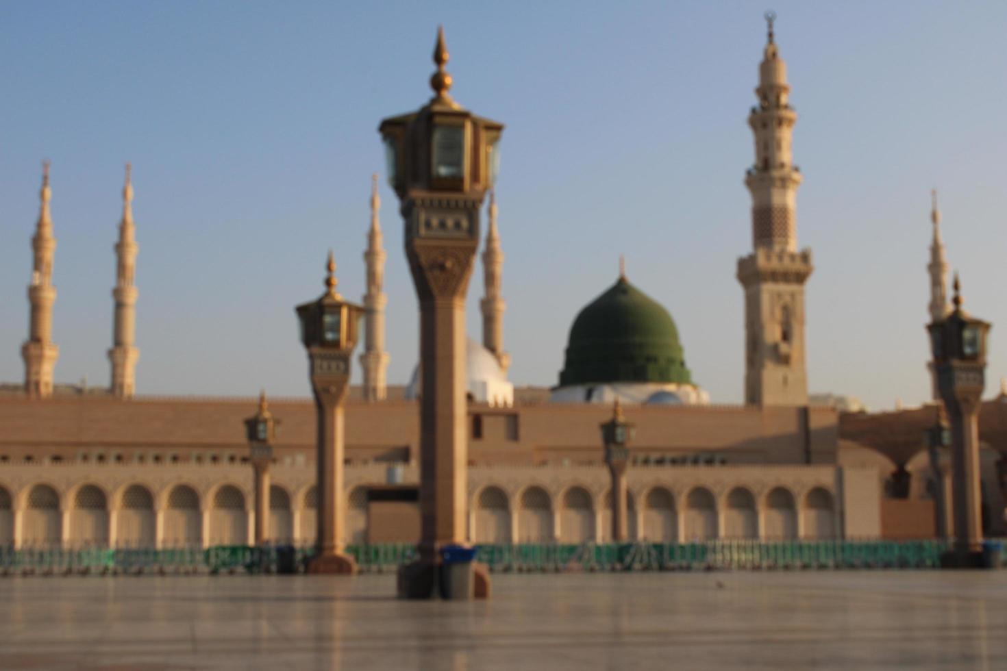 Medina, Saudi Arabia, Oct 2022 - Beautiful daytime view of Masjid Al Nabawi, Medina's green dome, minarets and mosque courtyard. photo