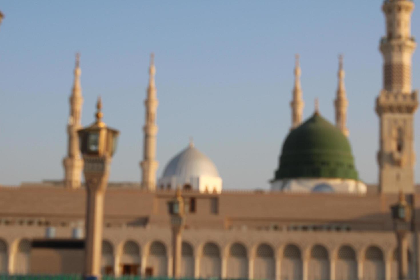 Medina, Saudi Arabia, Oct 2022 - Beautiful daytime view of Masjid Al Nabawi, Medina's green dome, minarets and mosque courtyard. photo