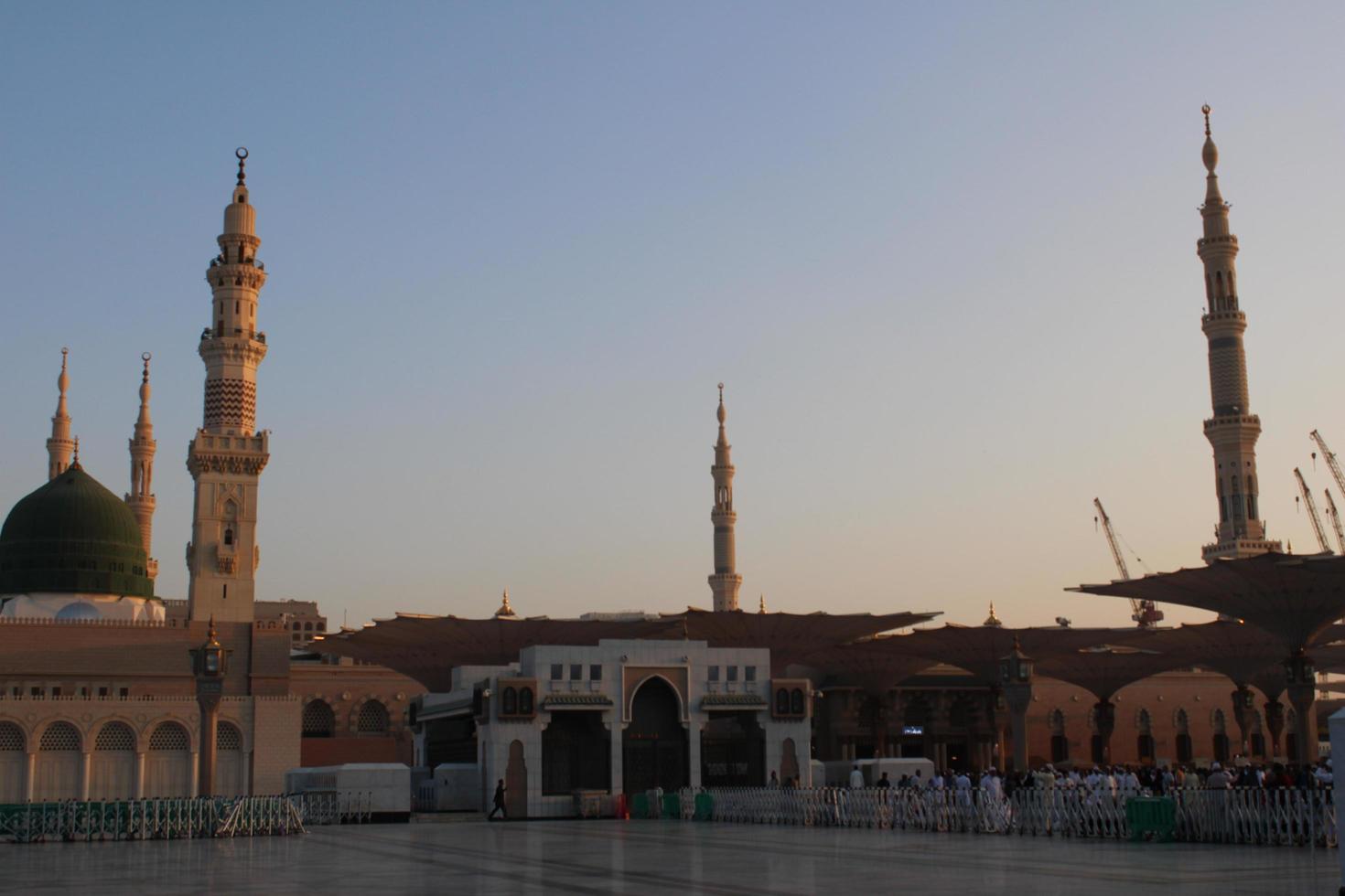 Medina, Saudi Arabia, Oct 2022 - Beautiful daytime view of Masjid Al Nabawi, Medina's green dome, minarets and mosque courtyard. photo