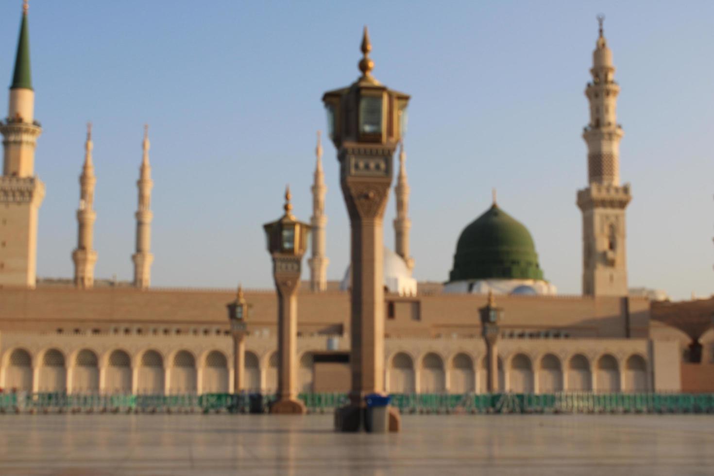 Medina, Saudi Arabia, Oct 2022 - Beautiful daytime view of Masjid Al Nabawi, Medina's green dome, minarets and mosque courtyard. photo