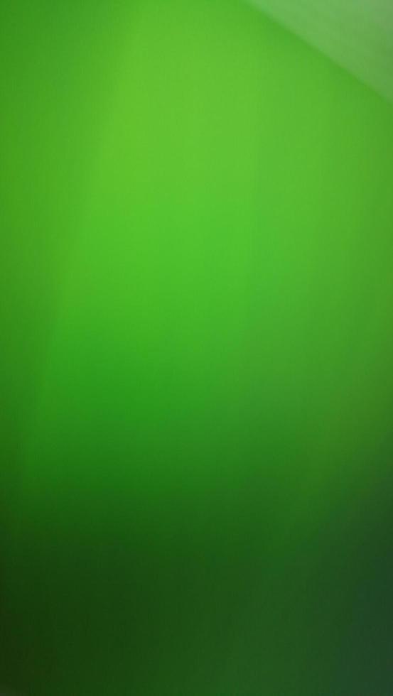 Imaginative blurred green shades, Blur green gradient abstract background. Mobile phone wallpaper. photo