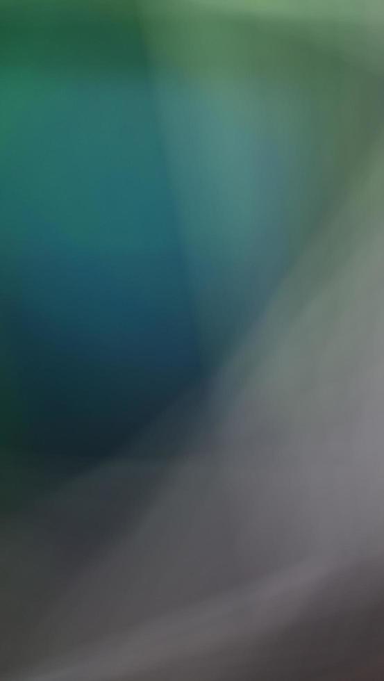 Imaginative blurred green shades, Blur green gradient abstract background. Mobile phone wallpaper. photo